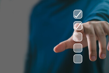 A focused hand reaching towards checkboxes, symbolizing decision-making and task completion in a...