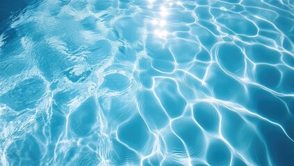 Obraz premium Blue Water Texture Background with Ripples and Reflections in Swimming Pool, Top View for Summer Vacation