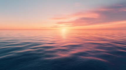 Obraz premium The image depicts a serene sunset over a tranquil ocean, with the sky painted in vibrant shades of orange and pink, creating a breathtaking and peaceful scene.