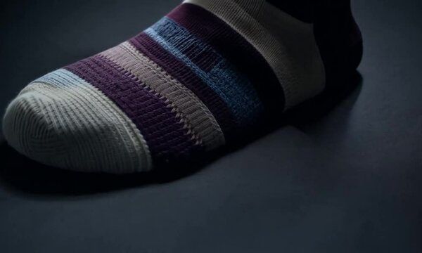 Dark background with sock collection . Generative AI