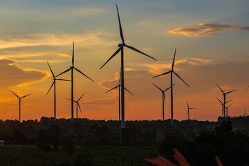 Obraz premium Wind turbine in sunset. renewable energy.renewable energy to businesses, homes, and public buildings.smart city