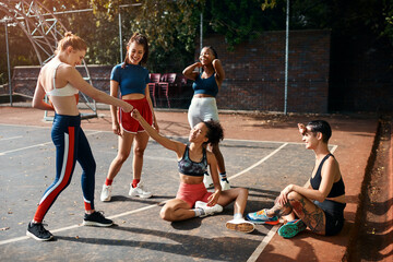 People, greeting and basketball team for fist bump, outdoor and support players on sports court. Women, communication and plan for game strategy on playground, together and hello at fitness training