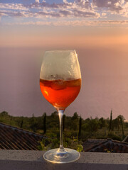 Half-Filled Cocktail Glass with Atlantic Ocean View in Background