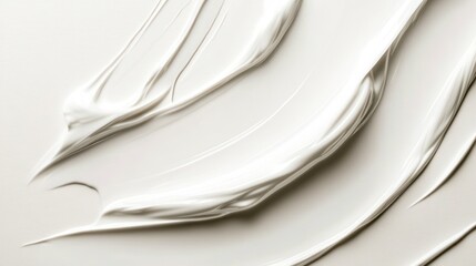 A smooth, creamy texture spread across a surface, suggesting a cosmetic or art medium.