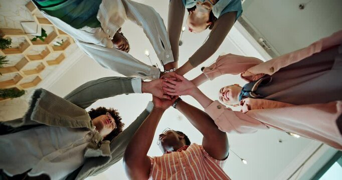 Hands, stack and low angle for teamwork in office, motivation and celebration with goals at company. People, circle and excited with link, cheers and group with synergy in scrum at creative agency