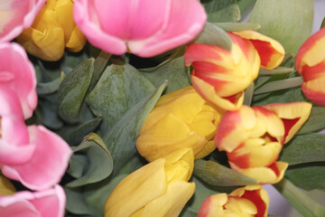 Fototapeta premium bouquet of flowers with yellow and pink tulips