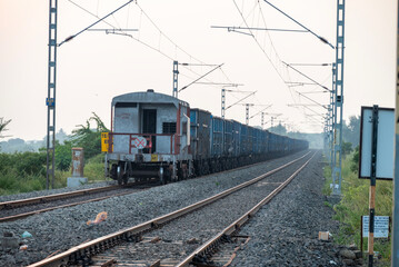 Railway track in India. Indian Railways Diesel-Electric Multiple Unit train