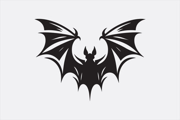 A black silhouette of a flying bat with outstretched wings.