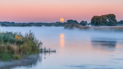 Fototapeta premium Serene Sunrise Over Misty River Landscape