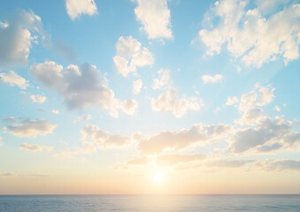 Obraz premium The blue sky is covered with white clouds and the sun sets on the sea surface. The sky's color gradient gradually changes from light yellow to deep orange. A few thin and large cotton candy.