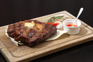 Medium rare steak placed on pita bread on a special wooden board. Beef steak on a wooden board.