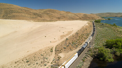 Scenic Train Journey Through Remote Desert Landscape