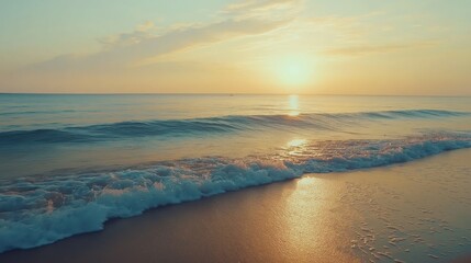Fototapeta premium As dawn breaks, golden rays dance on the gentle ocean waves, creating a peaceful atmosphere. The horizon glows softly, inviting a new day filled with potential.