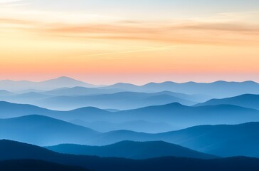 panoramic view of the majestic mountains under an orange and blue sky