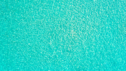 Turquoise sea wave ripple curl water surface texture. Summer holiday relax background with copy space.