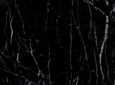Black marble wall texture for design art work. seamless pattern of tile stone with bright and luxury.
