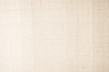 Closeup detail of beige fabric texture background. High resolution photo.