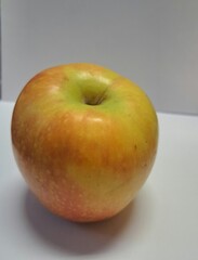 apples in a bowl on the white background 