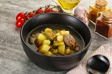 Soup with meatball and potato