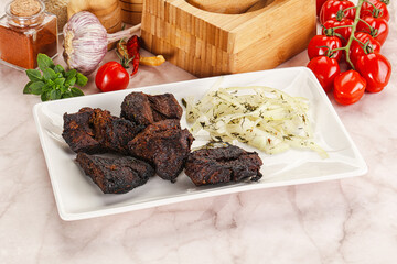 Grilled beef barbecue served onion