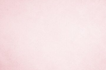 A vintage pink paper texture background with a grunge feel, perfect for art and design projects.