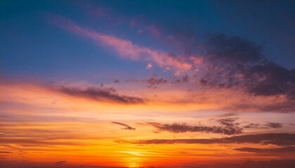 Obraz premium Breathtaking sunset sky with a gradient of orange, pink, and blue hues. Background photos for banners, posters and wallpapers.