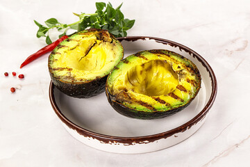 Sliced fresh avocado on the grill