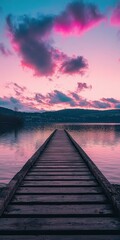 Fototapeta premium Sunset over calm lake with wooden pier stretching into the water