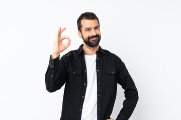 Young man with beard over isolated white background showing ok sign with fingers