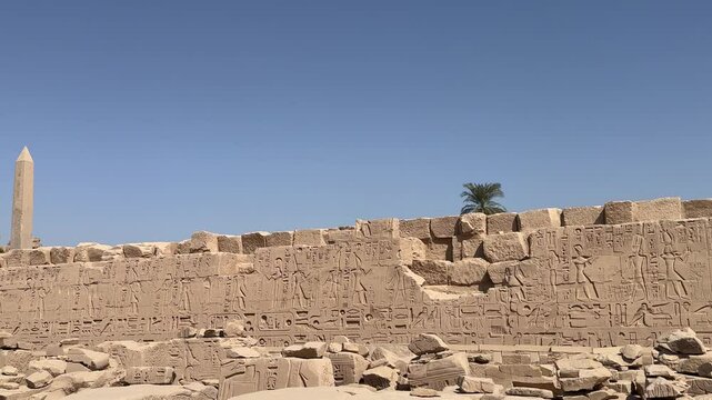 Karnak Egypt Luxor obelisk with wall with hieroglyphs