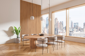 Stylish home living room interior with dining table and chairs, panoramic window