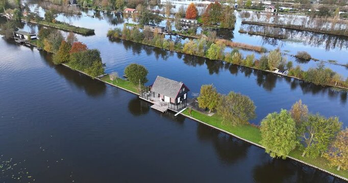 Small recreational houses at Scheendijk, water and recreational area, Loosdrechtse plassen. Aerial drone video