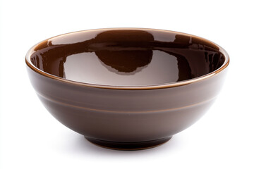 Brown bowl with a brown rim filled with vibrant, assorted fruits on a white marble tabletop. A splash of color against the neutral backdrop.
