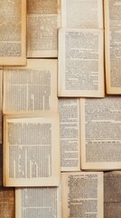 Obraz premium A collection of open book pages arranged haphazardly, showcasing text and definitions.