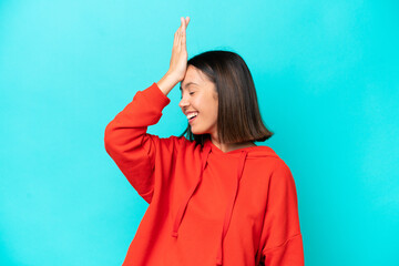 Fototapeta premium Young caucasian woman isolated on blue background with headache