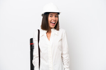 Young architect woman with helmet and holding blueprints isolated on white background with surprise facial expression