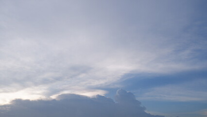 The soft bule sky is covered by the fluffy white cloud