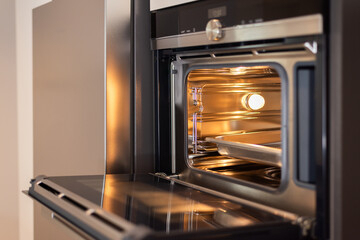 Empty open electric oven with hot air ventilation.