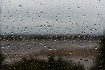 Rain drops on window glass close up macro. background texture with rain drop