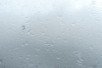 Raindrops on window glass. Rainy weather.