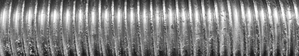 Texture of metal bolt thread. Abstract banner.