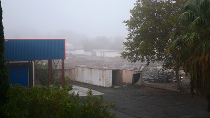 Abandoned warehouses, iron container, top view, fog, France, Europe