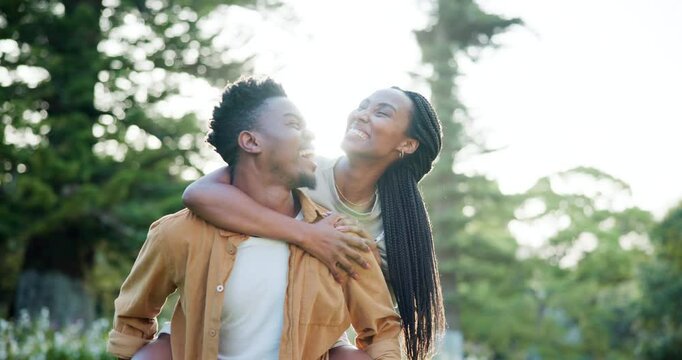 Outdoor, black couple and happy with piggyback for fun, date or bonding as lovers in Kenya. Park, people and smile in relationship as soulmate in love, care and trust with break to relax and chill