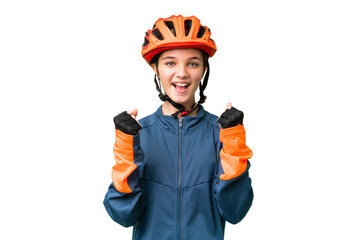 Teenager cyclist girl over isolated chroma key background celebrating a victory in winner position