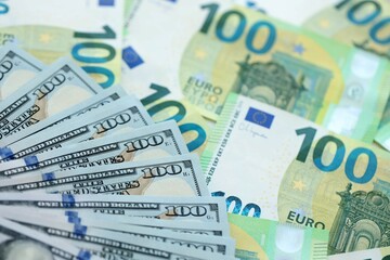 Big pile of Euro and USD banknotes. Many european and united states dollars