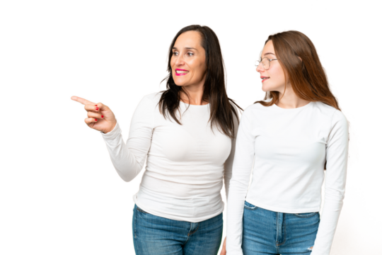 mother and daughter over isolated chroma key background pointing to the side to present a product - Powered by Adobe