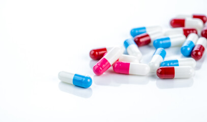 Prescription drugs. Colorful capsules on a white background. Healthcare standards, pharmaceutical ethics, and their essential role in patient treatment and safety within modern pharmacy practices.
