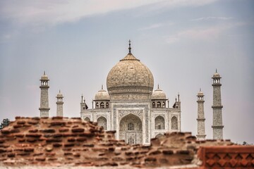 Fototapeta premium Views of the Taj Mahal through a wall in Agra