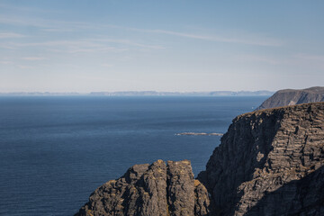 Norwegian fjord, with bright blue sky and the typical mountains of the North Cape 