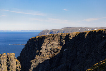 Norwegian fjord, with bright blue sky and the typical mountains of the North Cape 